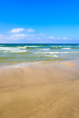 Fototapeta na wymiar Waves on Baltic Sea beach near Leba, Poland