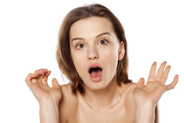 shocked pretty girl on a white background