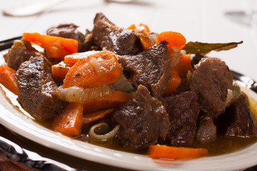 Plate of beef stroganoff with carrot