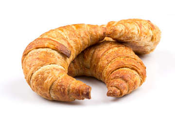 Croissant over white background