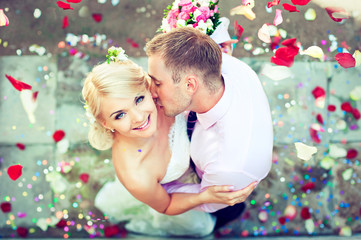 Beautiful wedding couple , groom kisses the bride