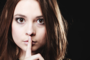 Naklejka premium Secret woman. Girl showing hand silence sign