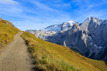 Fototapeta na wymiar Hiking path and view of Marmolada in Dolomites Mountains, Italy