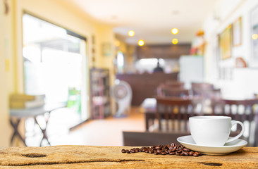 Fototapeta na wymiar Coffee shop blur background with bokeh