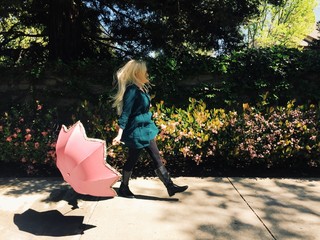 female walking with a parasol