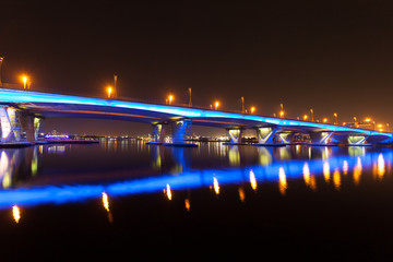 Naklejka premium Blue illuminated Al Garhoud Bridge in Dubai, UAE