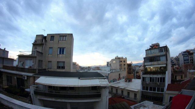 overview of Athens roofs at dusk