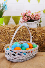Fototapeta na wymiar large basket with colored eggs