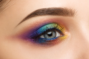 Obraz premium Close-up of woman eye with beautiful colourful makeup