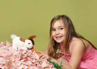Fototapeta na wymiar Girl feeding carrots to Easter Bunny