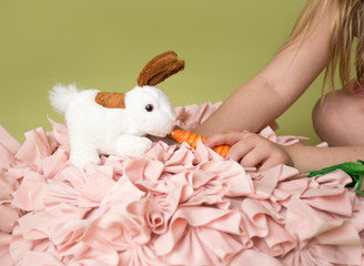 Girl feeding carrots to Easter Bunny