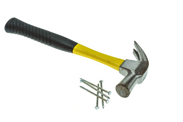 Old hammer with nail isolated on white