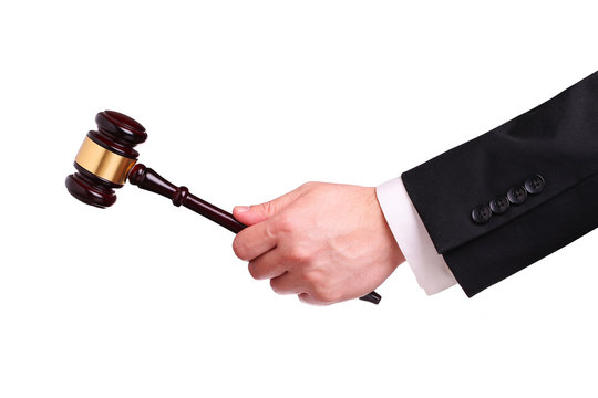 Gavel in hand isolated