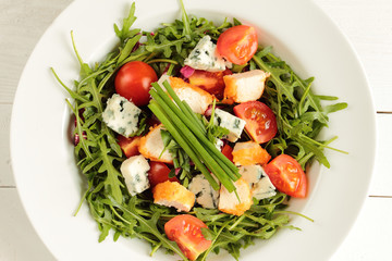 Fresh rucola, tomato, chive and mildew cheese with chicken
