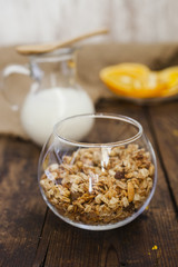 muesli with a bowl and milk in a jug