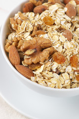 Oatmeal flakes with nuts in bowl