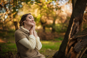 Young girl dreaming in the garden