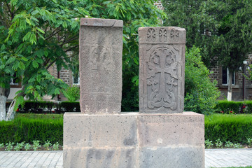 Fototapeta na wymiar Two grey carved khachkar stones, in Echmiadzin