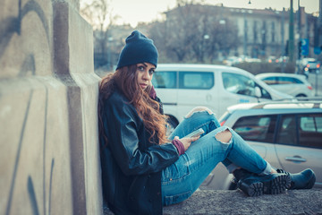 Beautiful girl posing in an urban context