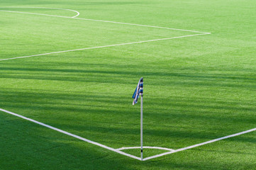 Corner flag marking background in soccer field
