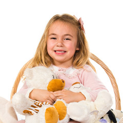 Little girl playing with stuffed animals