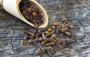 Cloves on vintage wooden background
