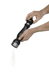 Two caucasian male hands using a pepper grinder