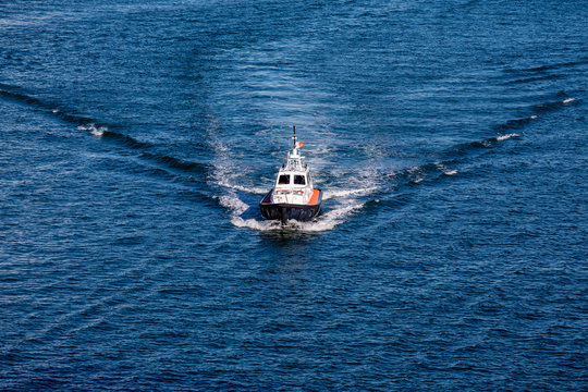 Pilot Boat Cutting Through Blue Water