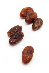Medjool dates isolated on a white background.