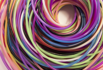 Fototapeta na wymiar colored spiral of thread on a white background
