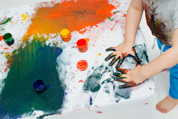 children's hands in paint