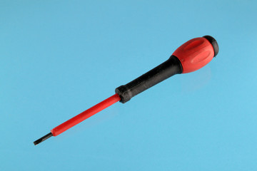 Red and black handeled screw driver. Chromakey background.