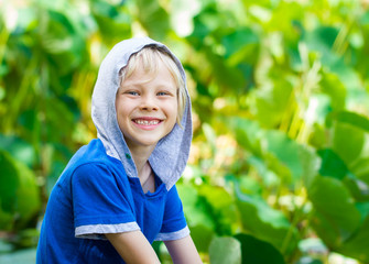 Portrait of a smiling, happy and healthy child in nature