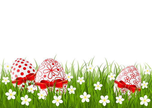 Easter red eggs on green grass