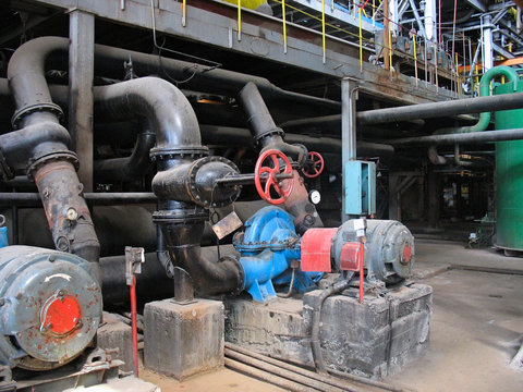 red valve and electric water pumps at power plant