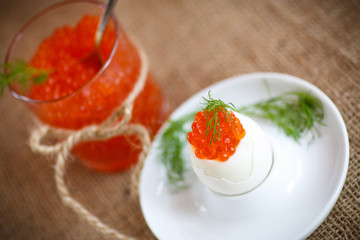 boiled egg with red caviar