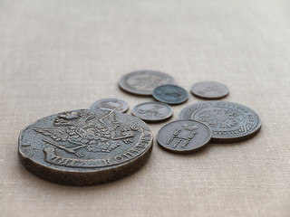 Old coins on the canvas background
