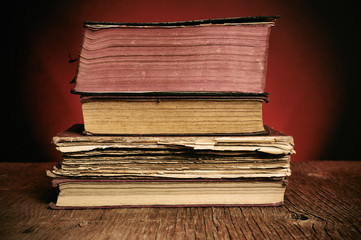 old books on a rustic wooden table