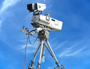 TV Professional studio digital video camera on blue sky