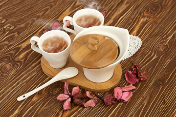 tea with sugar cubes on wooden