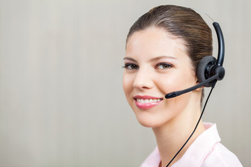 Female Employee Wearing Headset At Call Center