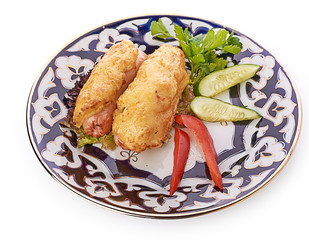 Meat on a grill with vegetables