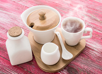 tea with sugar cubes on wooden