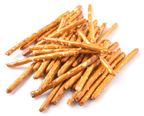 Brown, delicious pretzel sticks in a plastic container