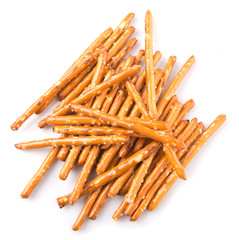 Brown, delicious pretzel sticks in a plastic container