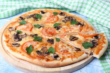Vegetarian pizza with tomato and mushrooms
