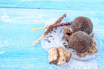 Cupcake with chocolate on wooden background