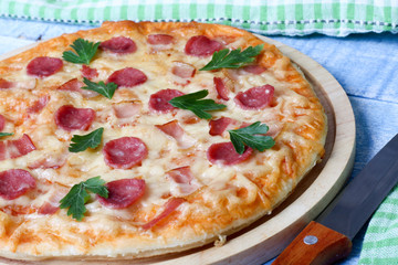 pizza with sausage and bacon