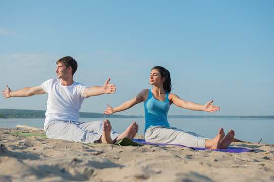 Young couple doing yoga