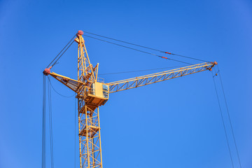 The site with cranes against blue sky